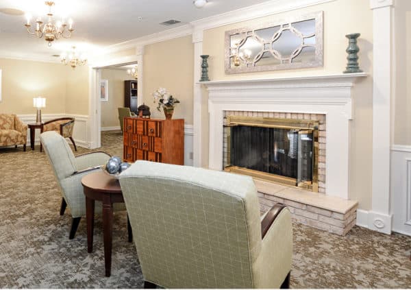 A beautiful lounge area with comfortable seating and a fireplace in Fort Wayne, Indiana.