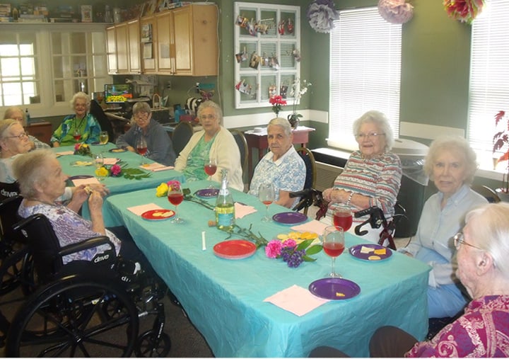 Residents of senior living facility enjoy eating treats in Anderson, South Carolina.