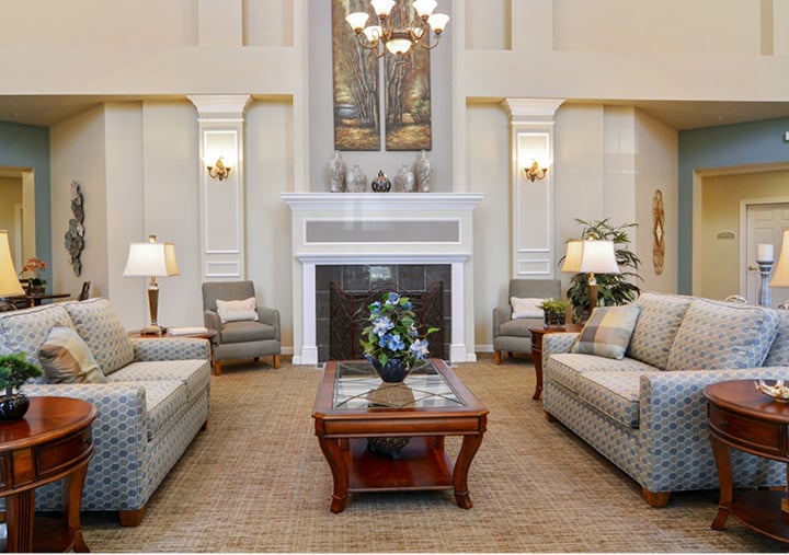 A beautiful lounge area with grand fireplace and chandelier in Macedonia, Ohio.