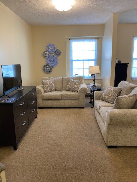 Living room area in a senior apartment at a senior living community in Elkhorn, Nebraska.