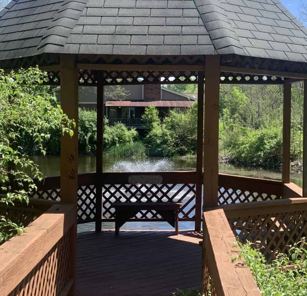 Country Charm senior living community in Greenwood, Indiana has a gazebo looking over a pond.