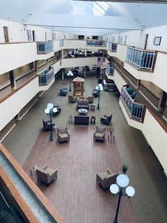 The Harrison, a senior living community in Indianapolis, Indiana has a large atrium with comfortable seating.