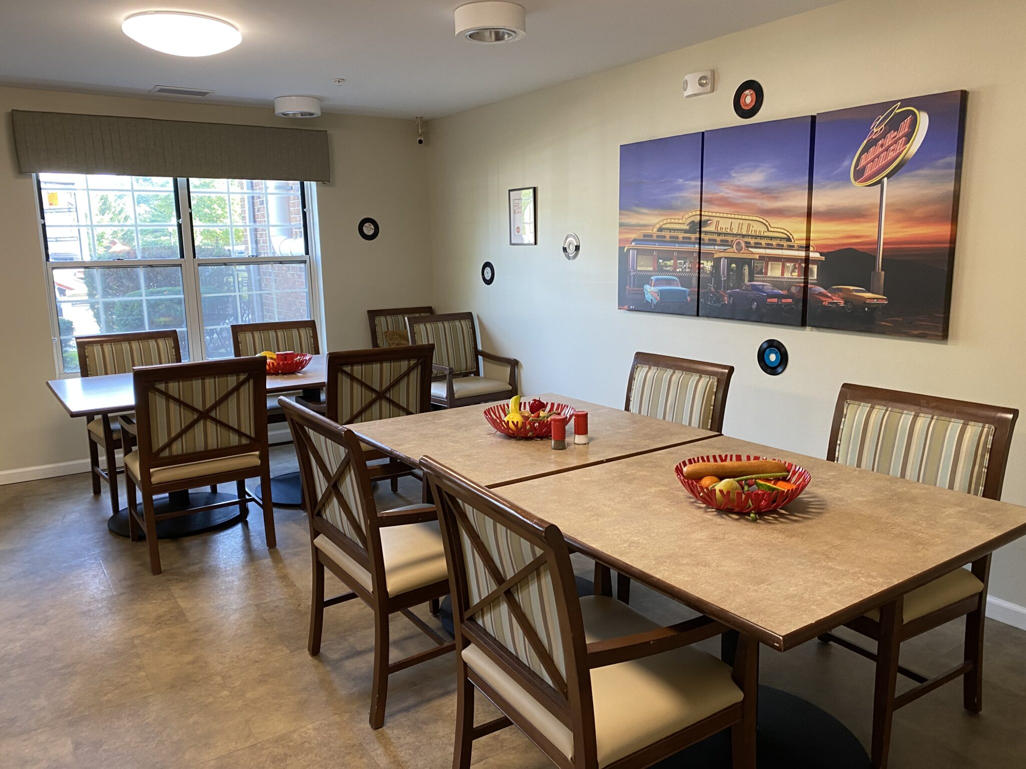 Dining room space with chairs and tables at a senior living community in Fort Wayne, Indiana