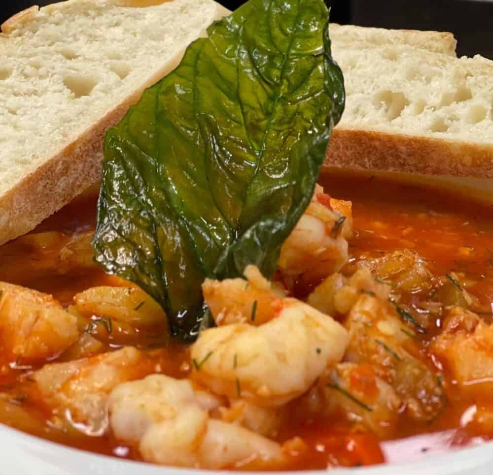 Close up of a bowl of soup with bread and a leaf for garnish at senior living community in Cincinnati, Ohio.