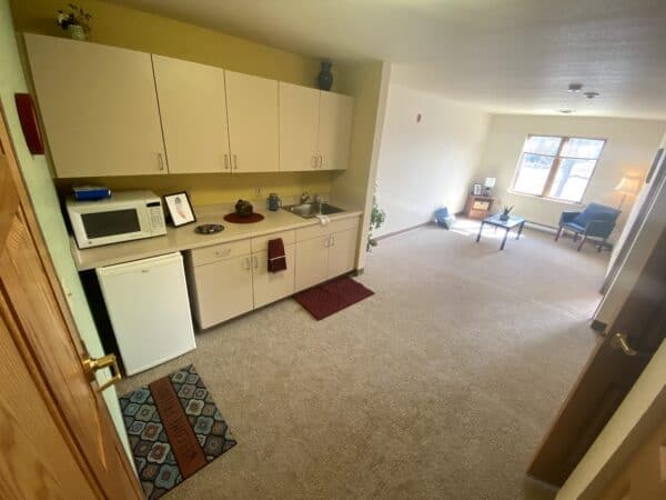Apartment kitchenette and living room at a senior living facility in Hartford, Wisconsin.