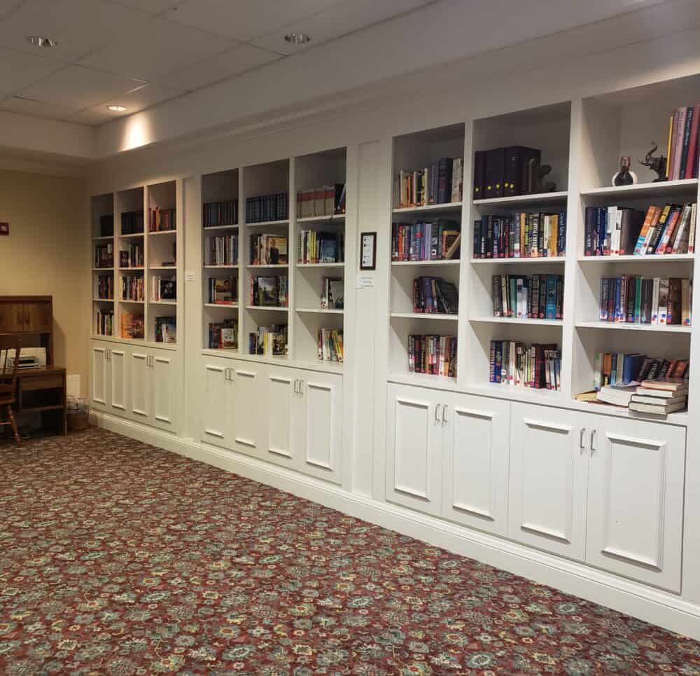 Library with rows and rows of books at a senior living community located in Fairfield, Ohio.