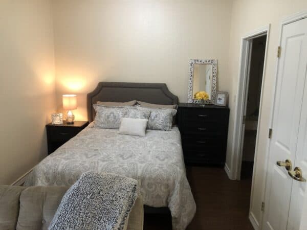 Model apartment bedroom at Good Tree senior living in Stephenville, Texas.