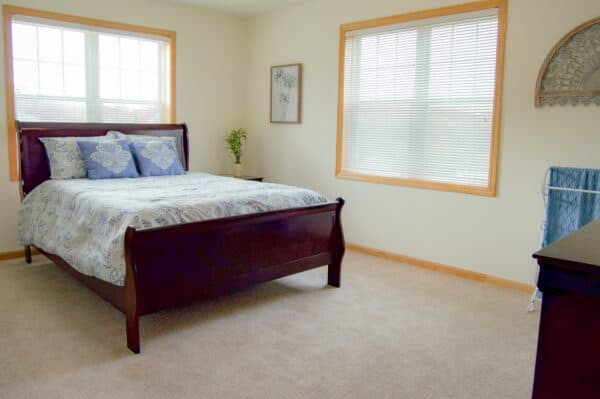 Senior apartment bedroom at The Waterford at Fitchburg senior living community in Fitchburg, Wisconsin.