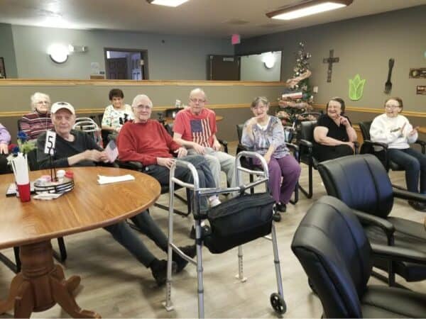 Group of senior men and women during a party at a senior living facility in Hartford, Wisconsin.