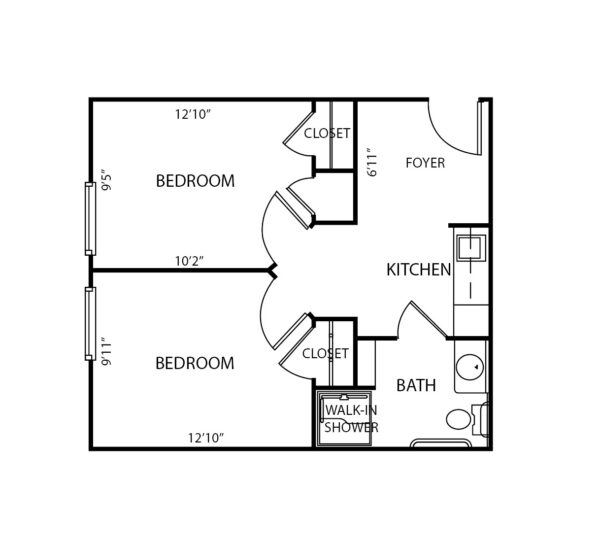 Two-bedroom apartment floorplan with two closets, bathroom and kitchenette at a senior living community in Hamilton, Ohio.