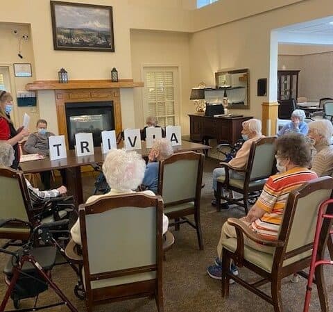 Group of seniors playing a game of trivia at Vintage Gardens, a senior living community in St. Joseph, Missouri.