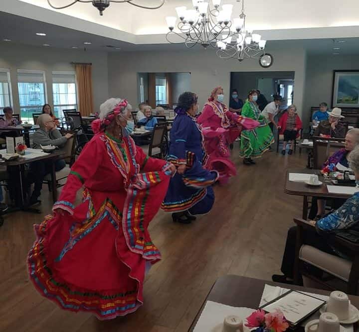 Group of dancers performing for seniors at a senior living facility in Baytown, Texas.