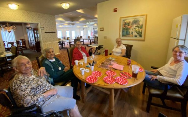 Group of senior ladies gathered around a table at a senior living community in Greencastle, Indiana.