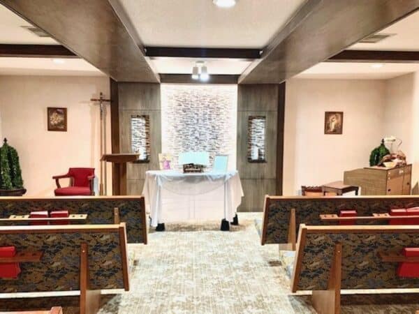 On-site chapel complete with aisles, kneelers and a podium area