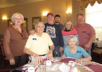 group of adults and seniors pose together