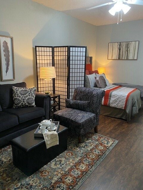 Studio apartment at a senior living community has a bedroom area and living room in Pensacola, Florida.