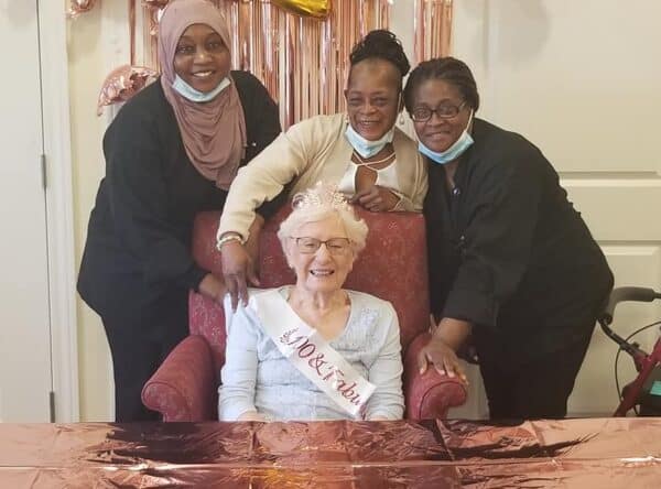 Group of women smile during a birthday celebration at a senior living facility in Dayton, Ohio.