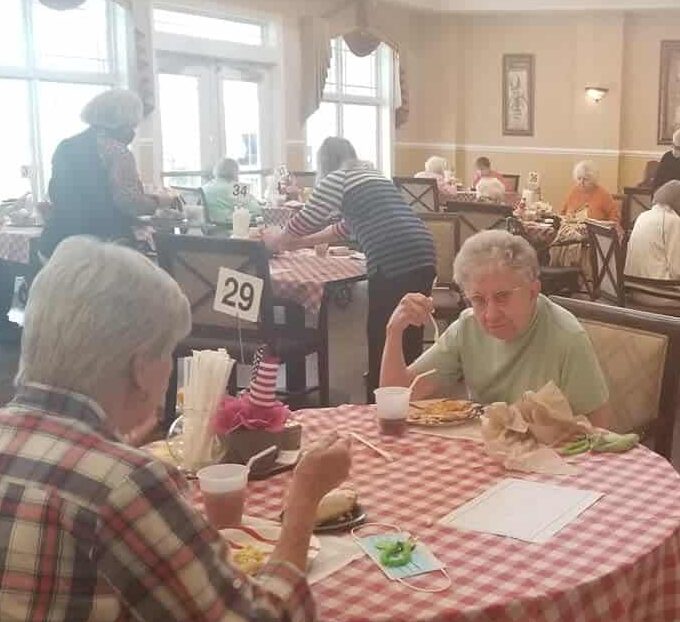 Group of seniors eating a meal together at a senior living facility in Dayton, Ohio.