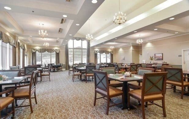 Large dining room with ample seating and natural light at the Waterford at Mansfield, a senior living community in Mansfield, Ohio.