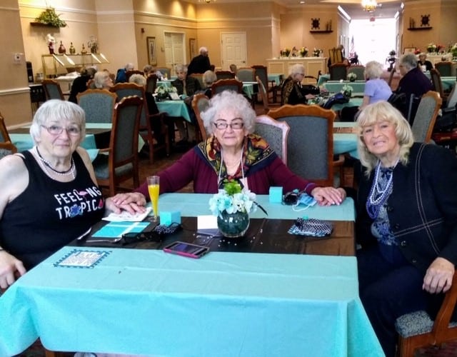 Three senior ladies enjoy dinner at a senior living community in Fairfield, Ohio.