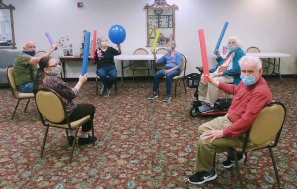 Group of seniors playing a game with balloons at a senior living facility in Fairfield, Ohio.