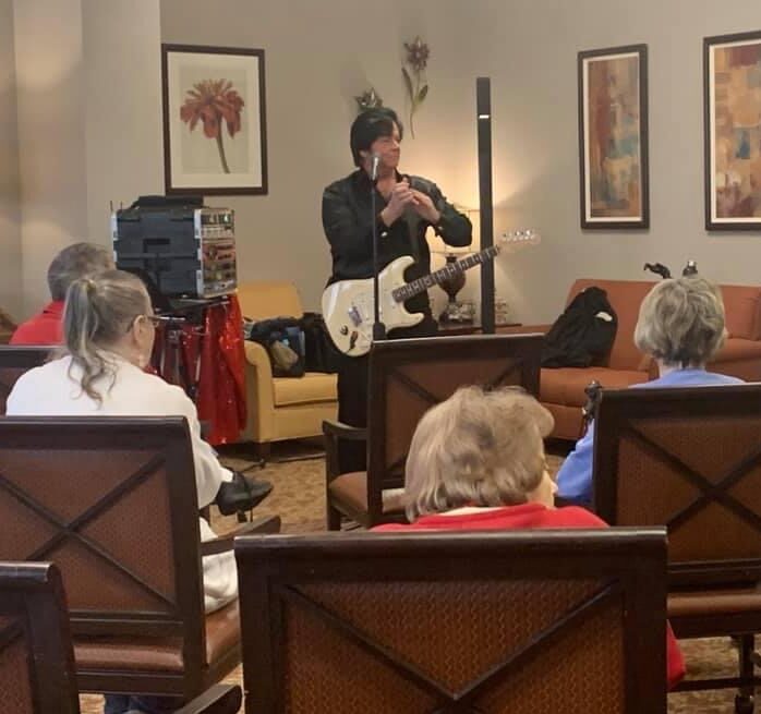 entertainer sings for residents