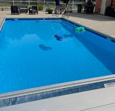 Outdoor, heated pool at Georgetowne Place at a senior living community in Fort Wayne, Indiana.