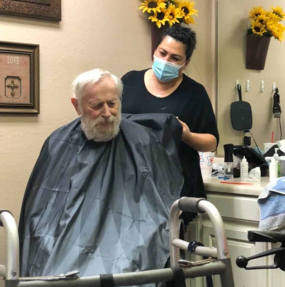 Senior man at the salon on-site at a senior living facility in Stephenville, Texas.