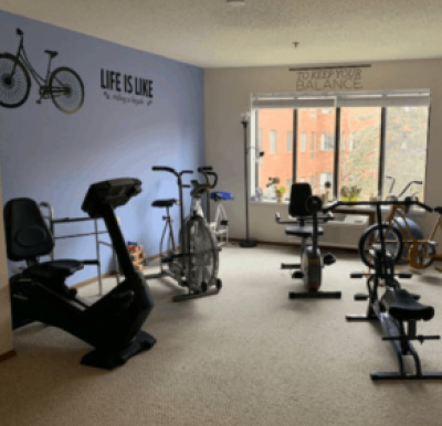 Indoor exercise room with stationery bikes at a senior community in East Lansing, Michigan.
