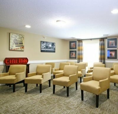 movie theatre with plenty of seating for seniors living at laurelhurst and laurelwoods