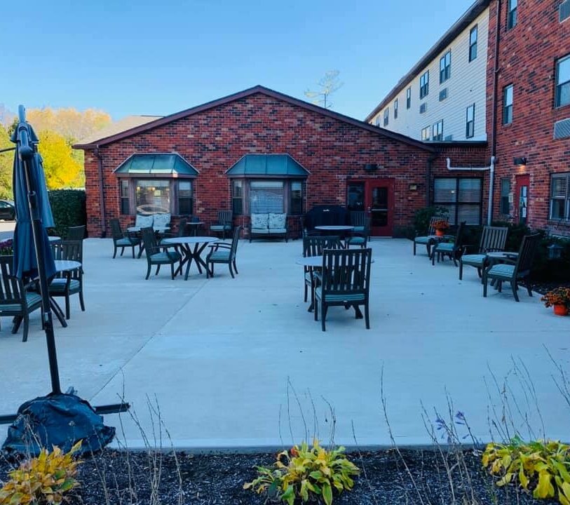 outdoor patio with tables and chairs at The Harrison