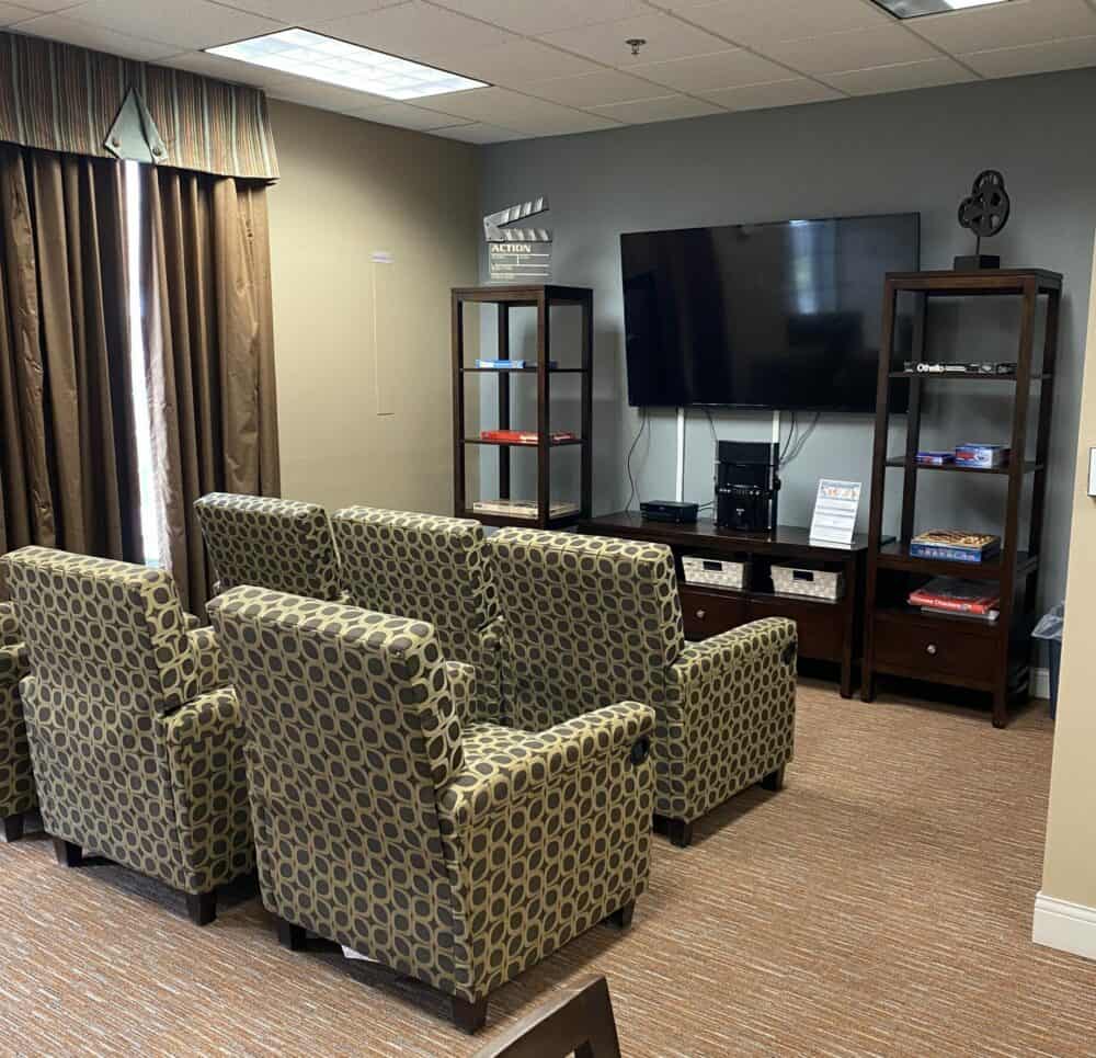 Media room with a large TV at the Waterford at Mansfield, a senior living community in Mansfield, Ohio.