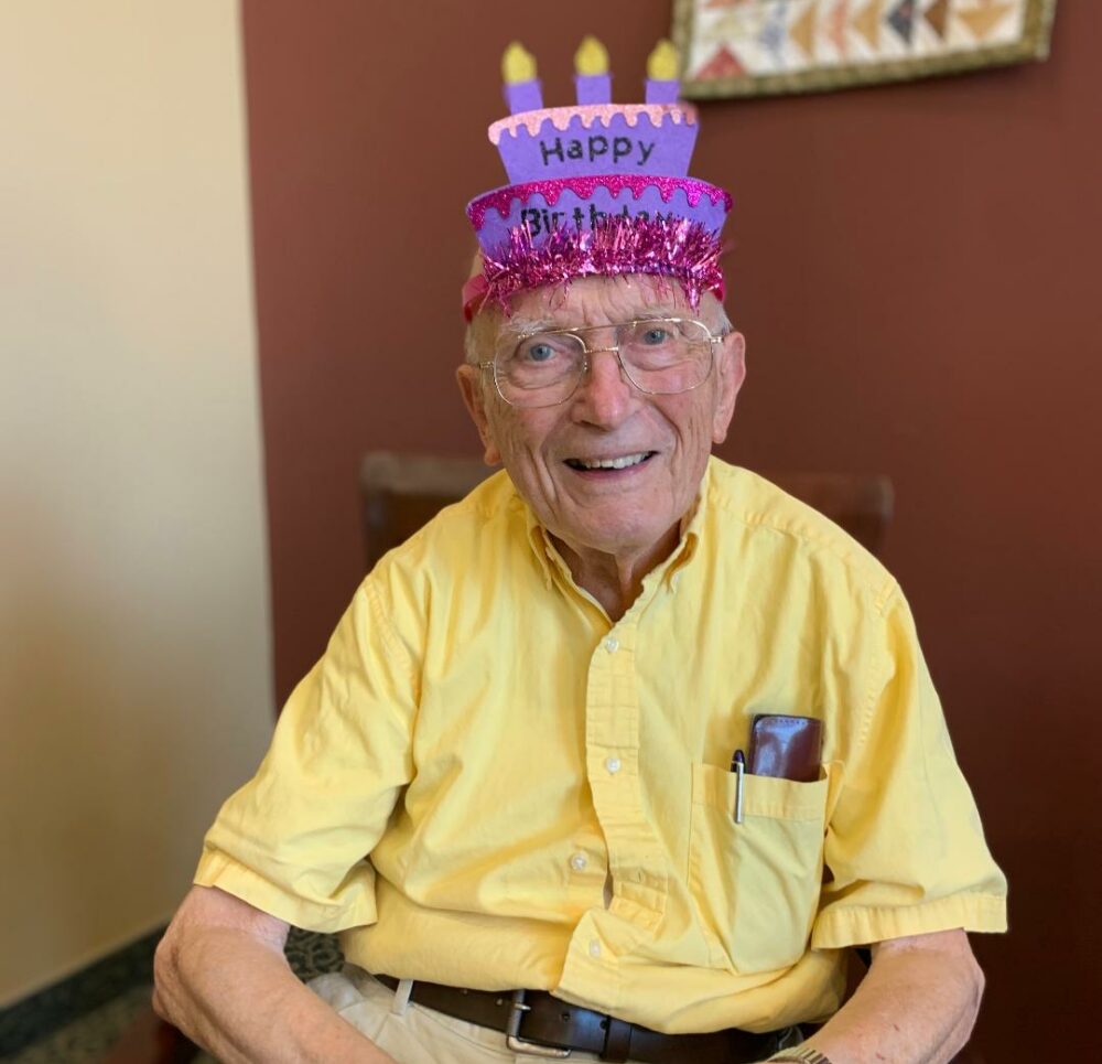 Senior man celebrates his birthday at Heritage at The Plains at Parish Homestead, a senior community in Oneonta, New York