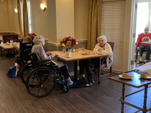Two senior women enjoy dinner at a senior living community in Shaker Heights, Ohio.