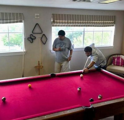 Two men play billiards at the Waterford at Thousand Oaks in San Antonio, Texas.