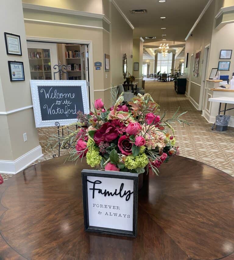 Lobby area with welcome sign at the Waterford at Mansfield, a senior living community in Mansfield, Ohio.