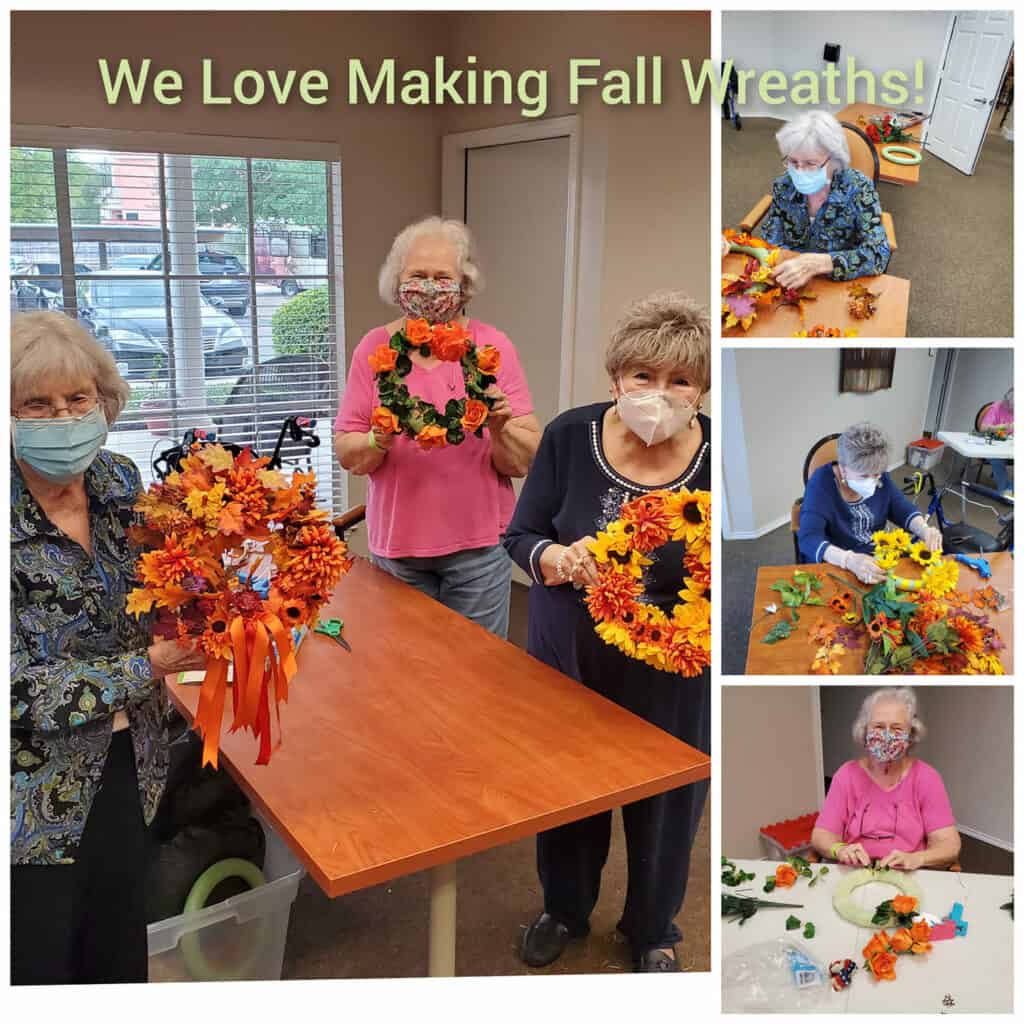 Senior women make fall wreaths with ribbon and artificial leaves.