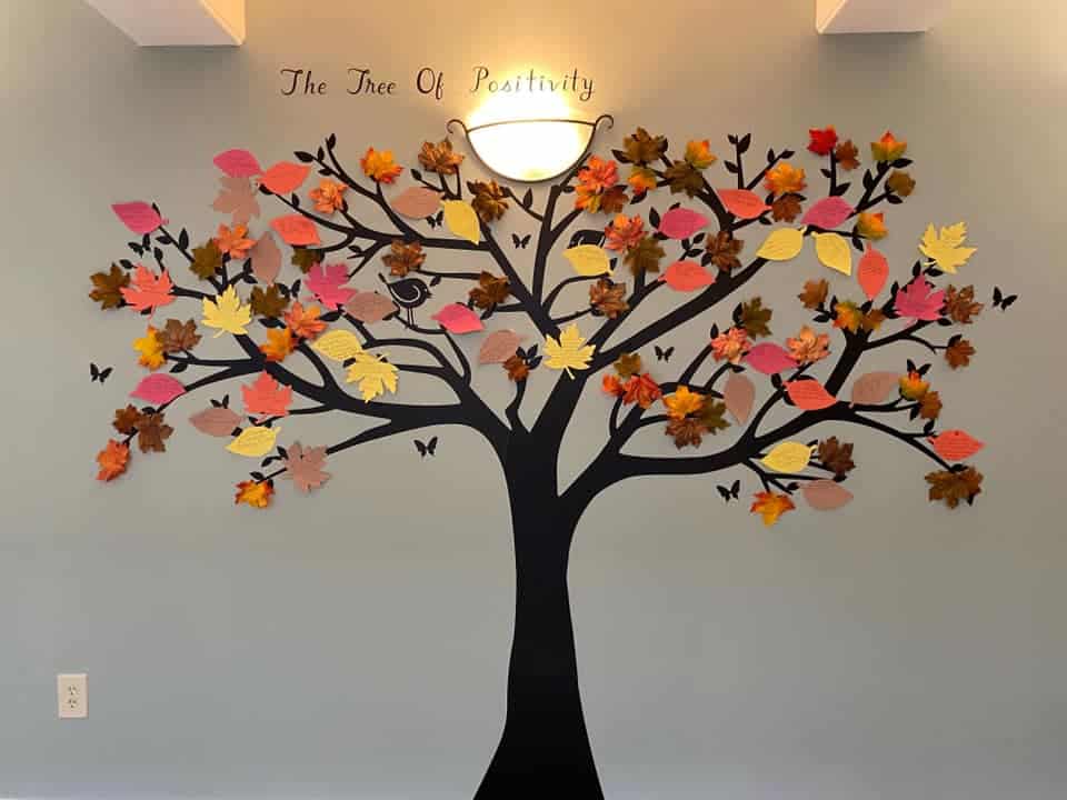 The tree of positivity on the wall of a senior living community.