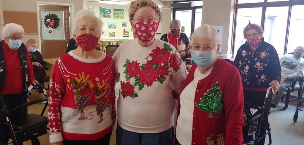 Women pose together during Christmas party in East Lansing, Michigan.