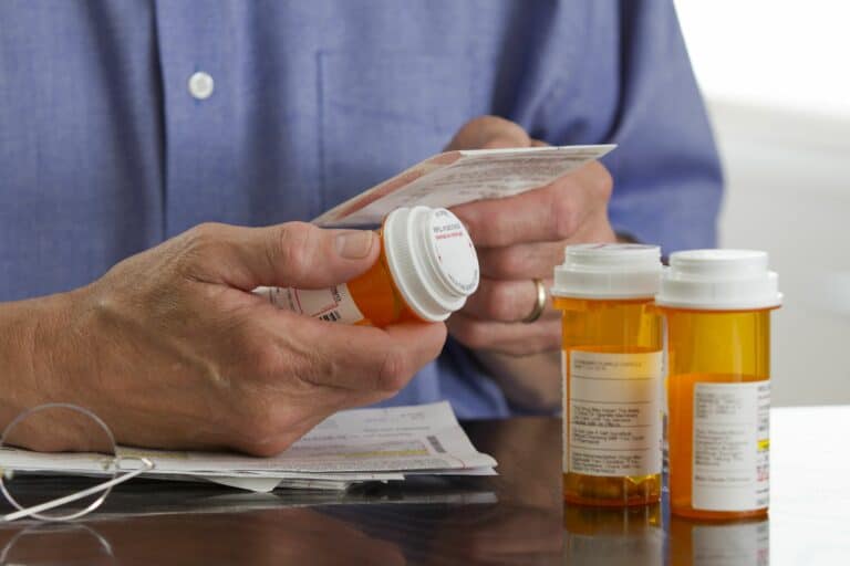 Older man with prescription medications