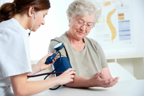Senior woman getting her blood pressure taken.