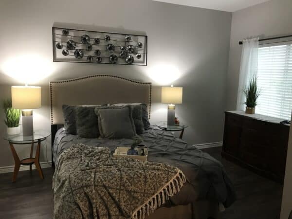 Apartment bedroom with queen bed and night stands in Corpus Christi, Texas.