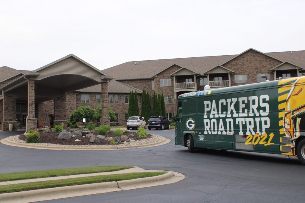 Green Bay Packers bus outside of senior living community in Green Bay, Wisconsin.