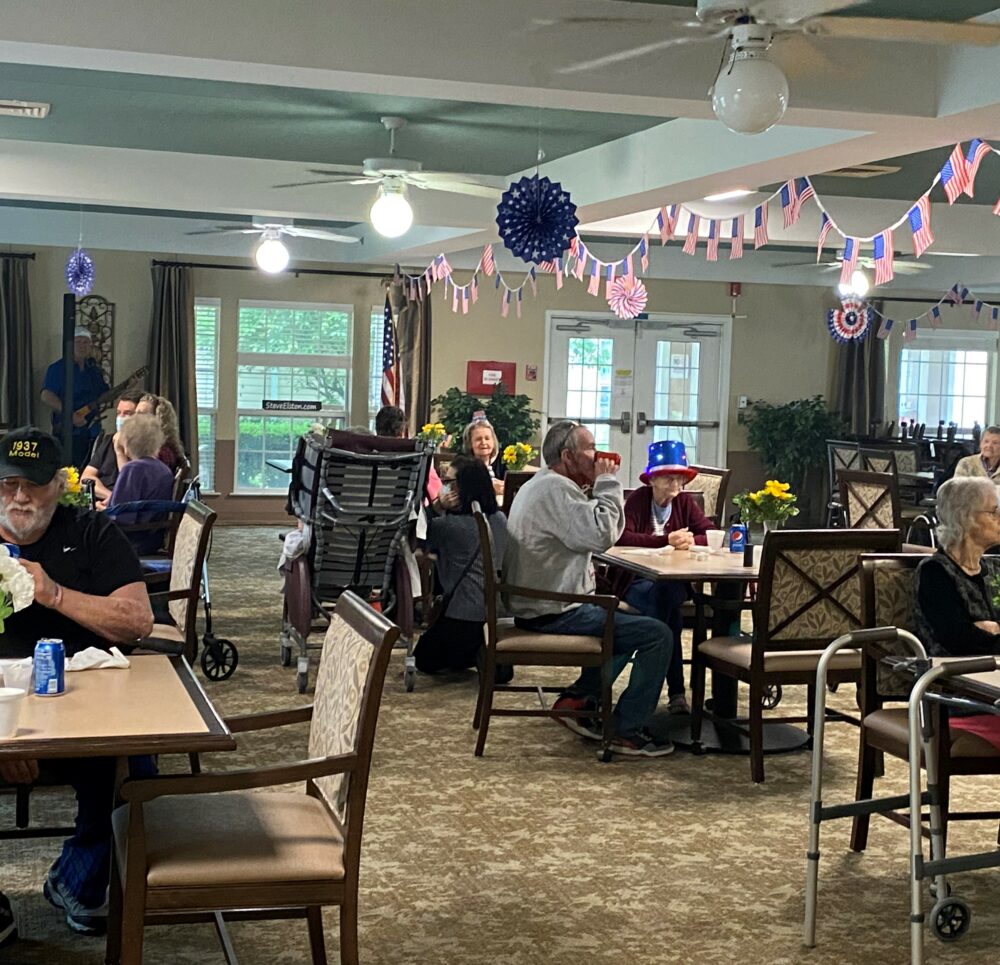 Seniors celebrate the Fourth of July in the main dining room at a senior living community in Indianapolis, Indiana.