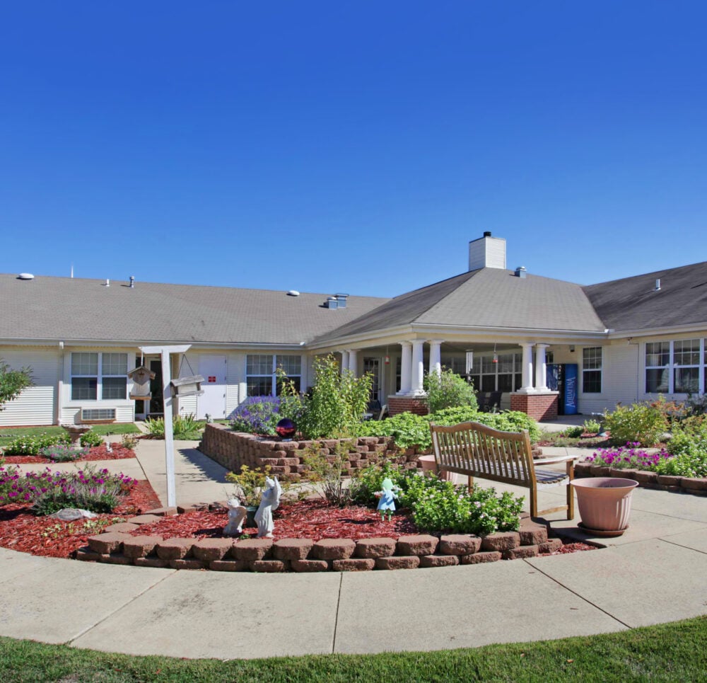 outdoor courtyard with walking path, benches and a patio