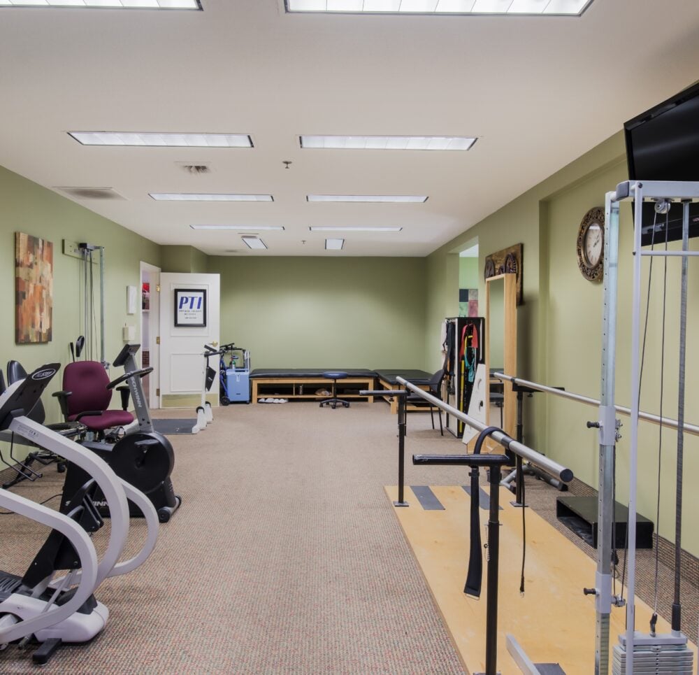 on-site gym with a bike and physical therapy equipment.