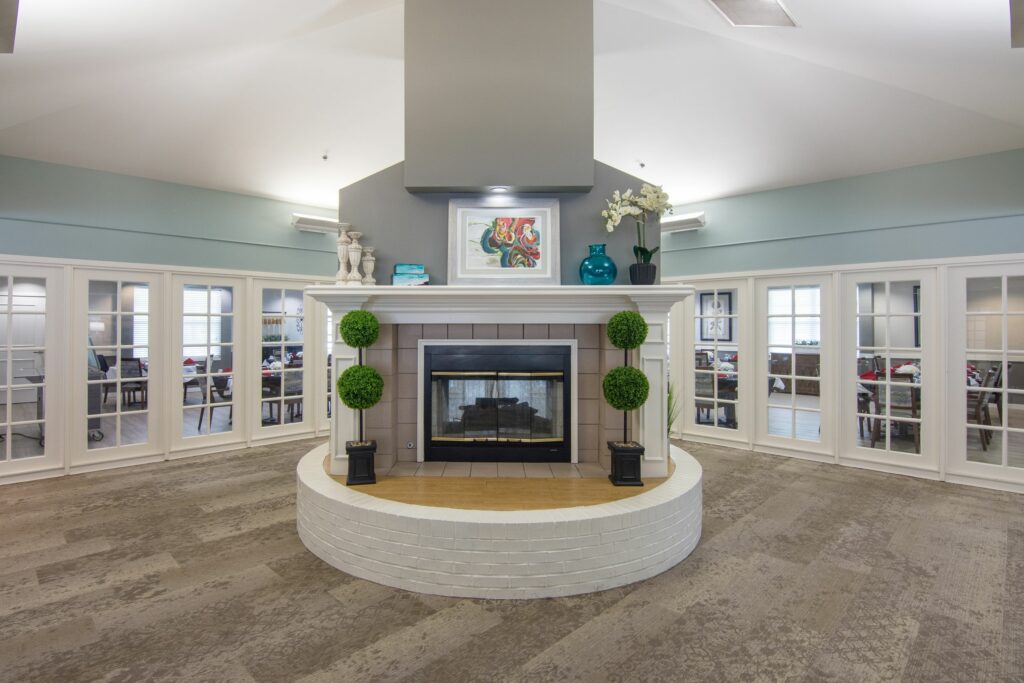 lobby with large fireplace and decorations surrounding it