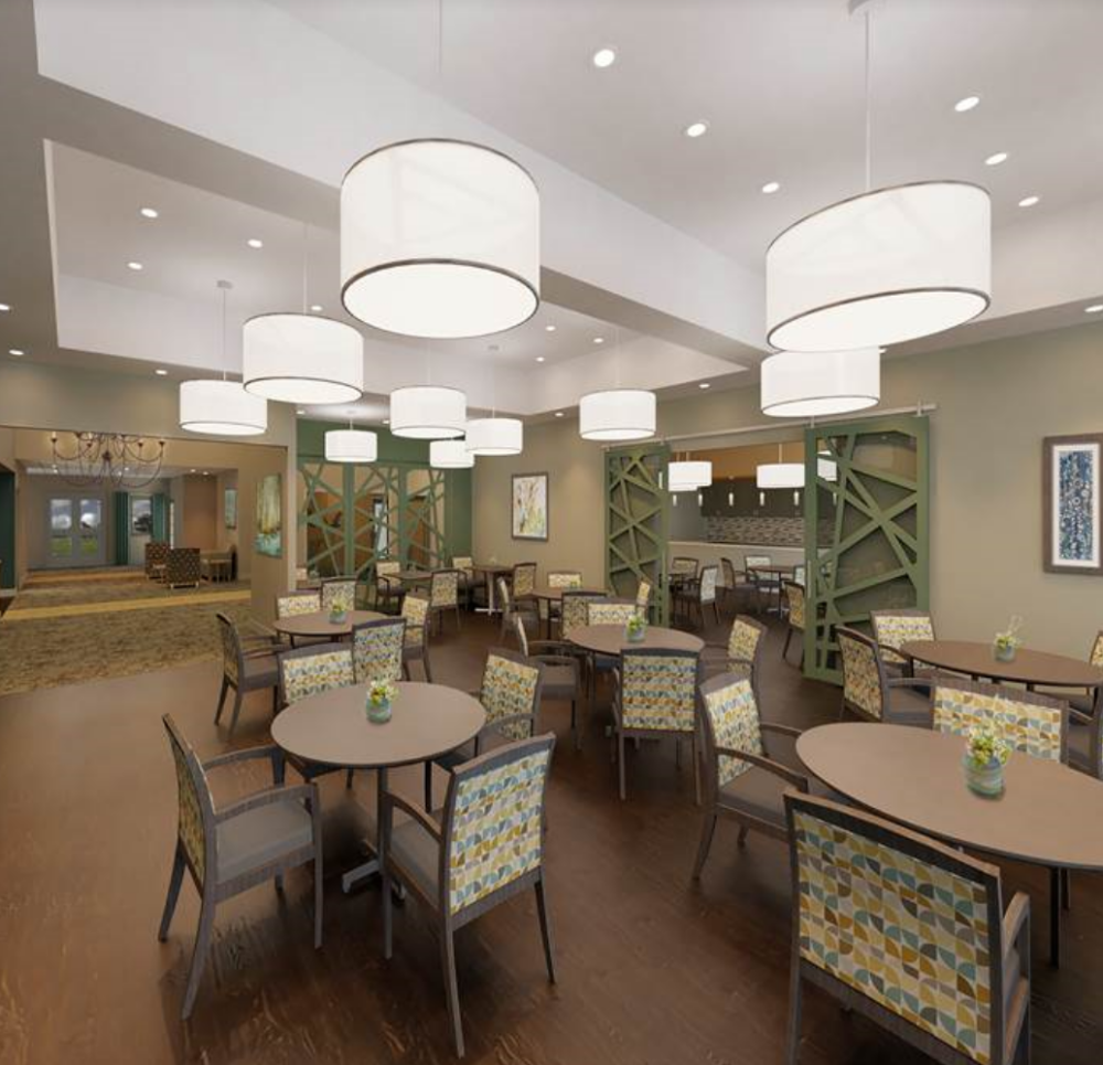 dining room space with multiple tables and chairs at the oaks at plainfield