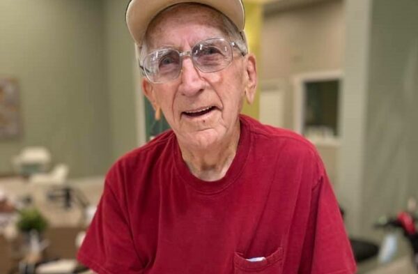 senior man smiles for the camera