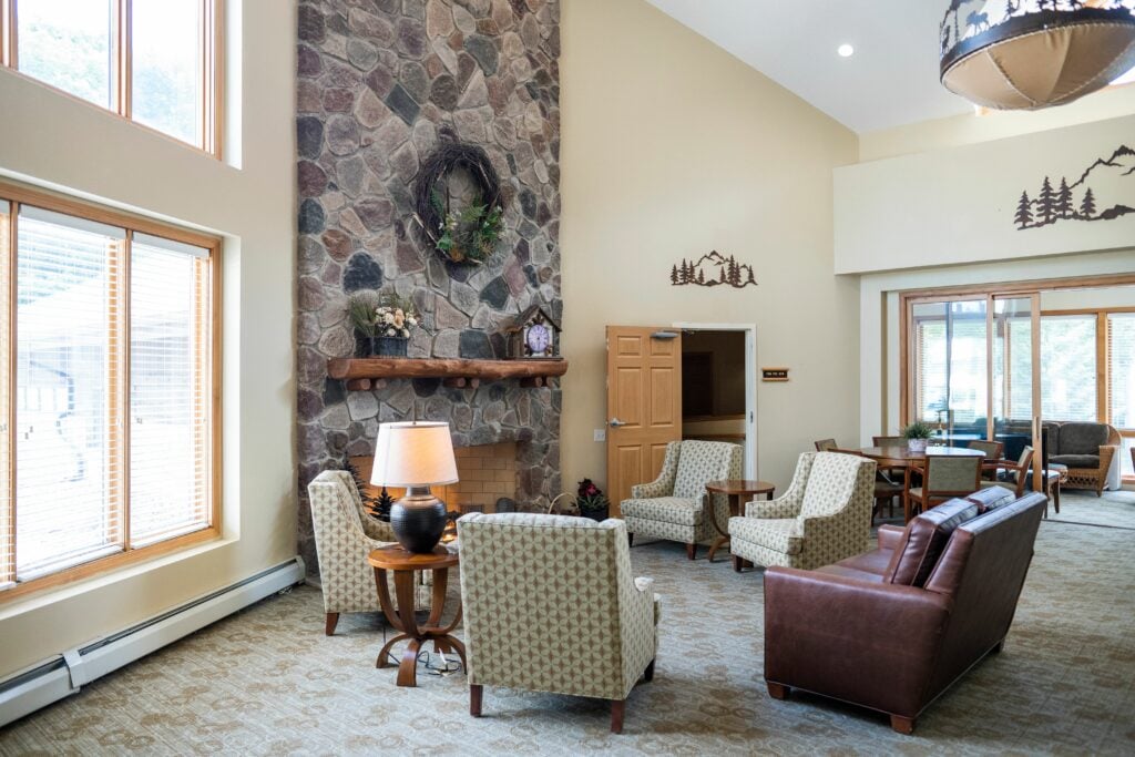 seating area near a fireplace and windows